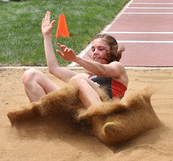 Michaela Birath stirs up the sand on her long jump landing at the Howard Wood Dakota Relays. She placed ninth.